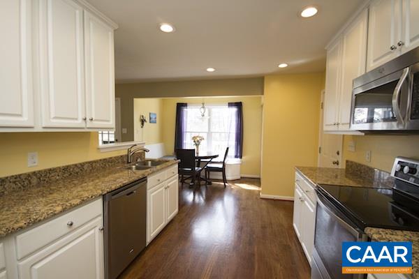 330 Northridge Road Ruckersville, VA 22968 - Photo 3 of 36 a kitchen with a sink stove and cabinets