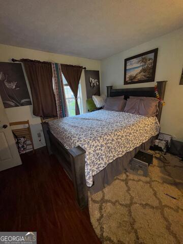 6444 Charter Way Lithonia, GA 30058 - Photo 11 of 18 a bed sitting in a bedroom next to a window