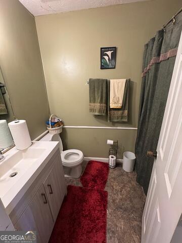 6444 Charter Way Lithonia, GA 30058 - Photo 12 of 18 a bathroom with a toilet and a mirror