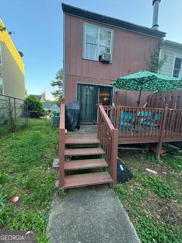 6444 Charter Way Lithonia, GA 30058 - Photo 15 of 18 a view of a wooden deck with a yard
