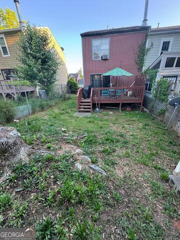 6444 Charter Way Lithonia, GA 30058 - Photo 16 of 18 a view of a house with a backyard and a patio