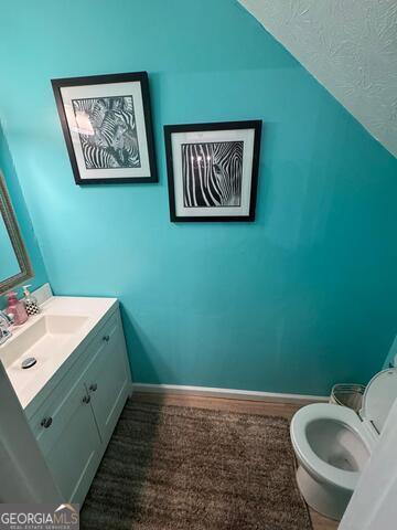 6444 Charter Way Lithonia, GA 30058 - Photo 7 of 18 a bathroom with a toilet and a sink