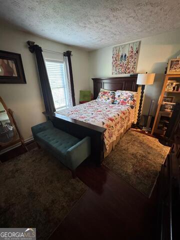6444 Charter Way Lithonia, GA 30058 - Photo 8 of 18 a bed sitting in a bedroom next to a window