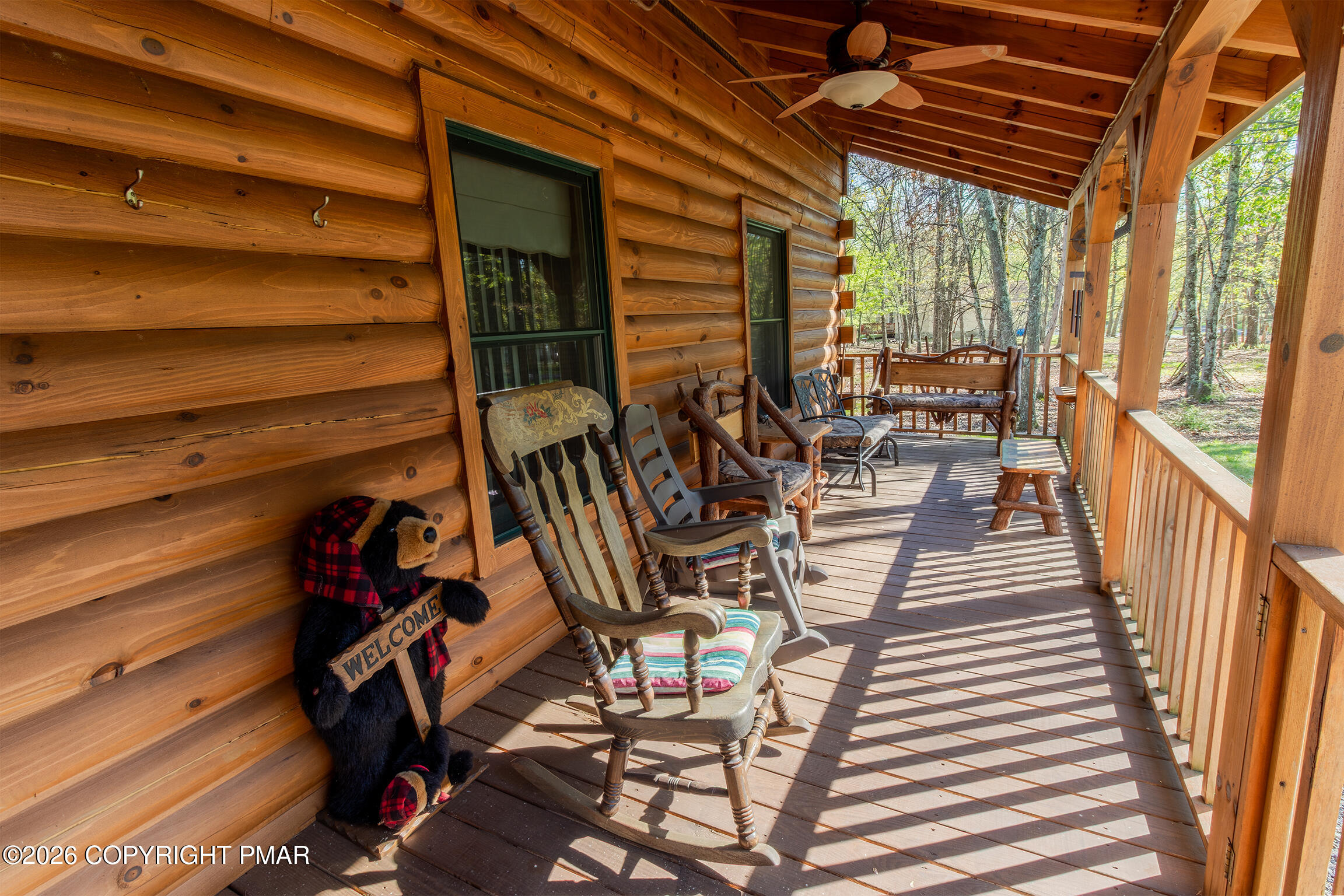 1160 Bluebird Lane Bushkill, PA 18324 - Photo 5 of 44 a view of a patio with table and chairs with wooden floor and fence
