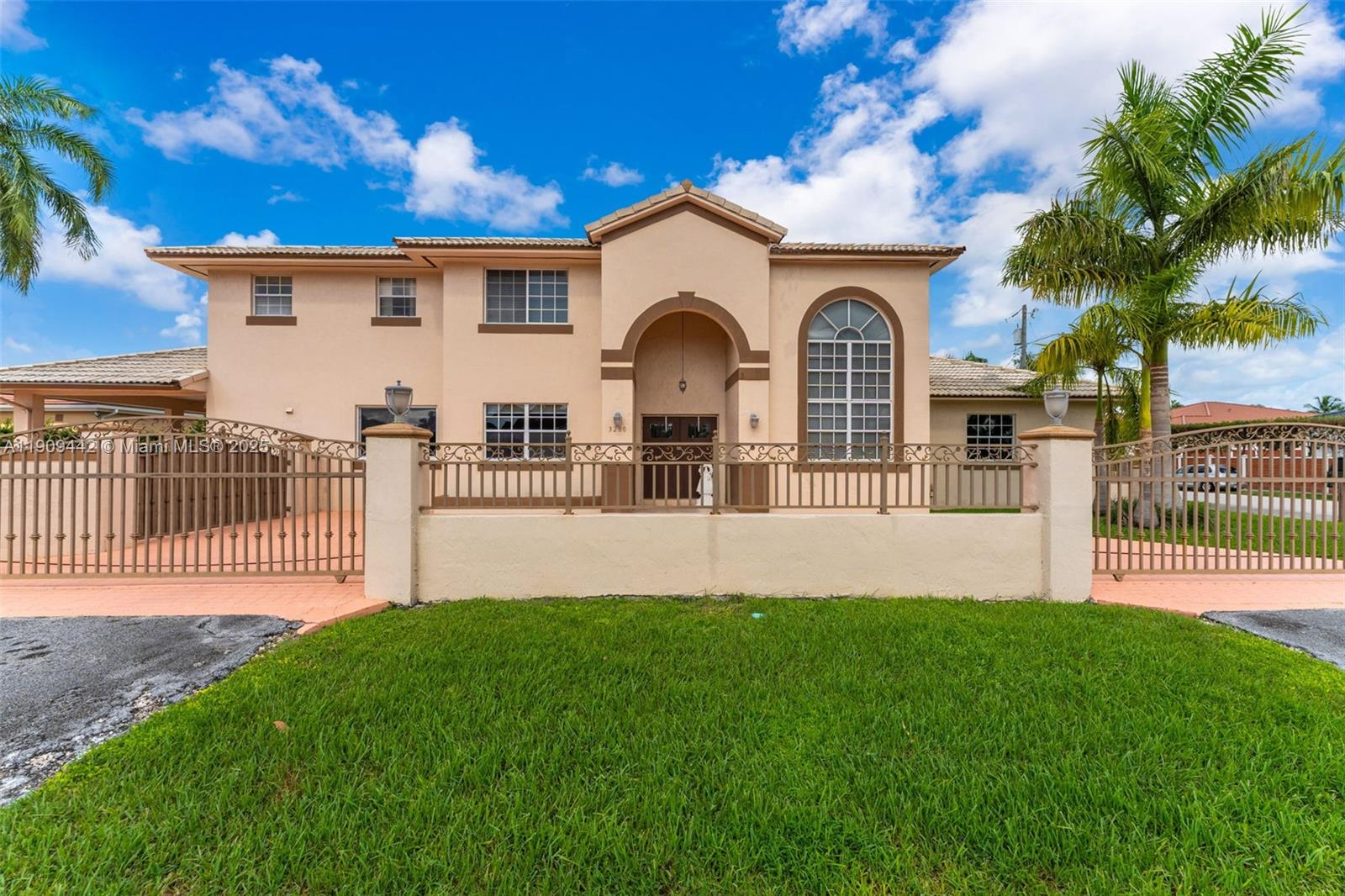 3200 Southwest 132nd Avenue Miami, FL 33175 - Photo 1 of 55 a front view of a house with a garden and yard