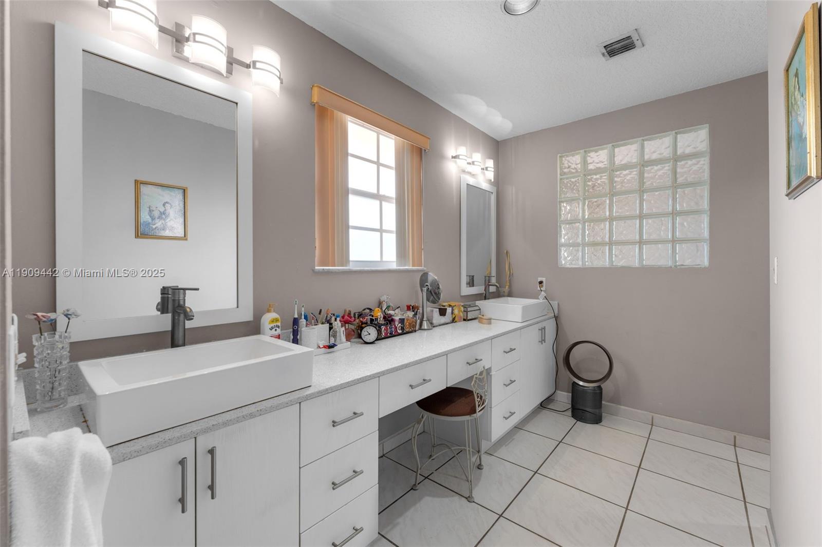 3200 Southwest 132nd Avenue Miami, FL 33175 - Photo 25 of 55 a bathroom with a sink a vanity and a mirror
