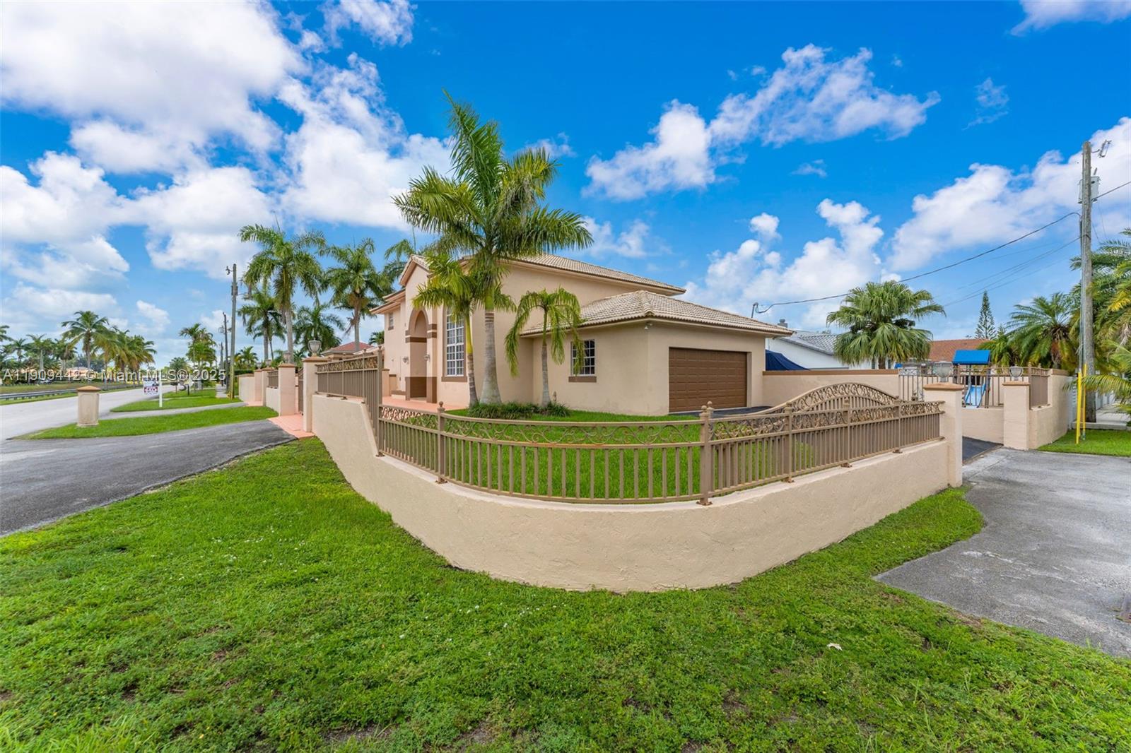 3200 Southwest 132nd Avenue Miami, FL 33175 - Photo 3 of 55 a view of a house with a big yard and potted plants