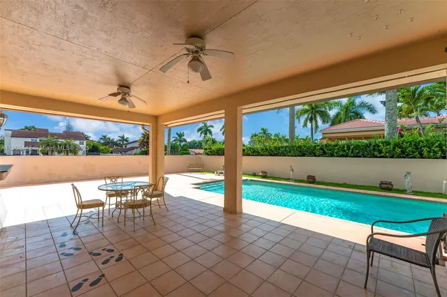 a view of a swimming pool and lounge chair