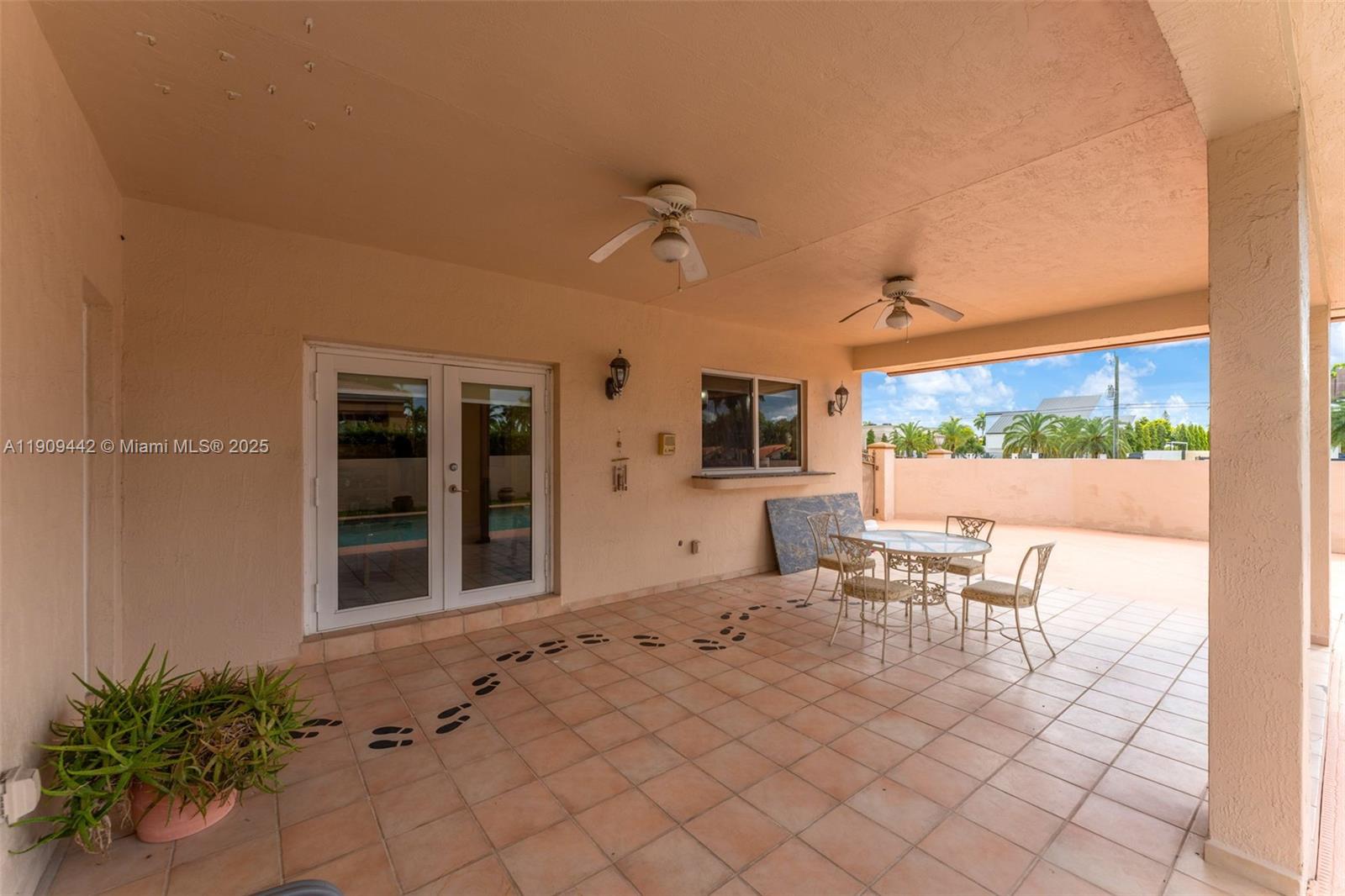 3200 Southwest 132nd Avenue Miami, FL 33175 - Photo 41 of 55 a living room with furniture a window and a flat screen tv