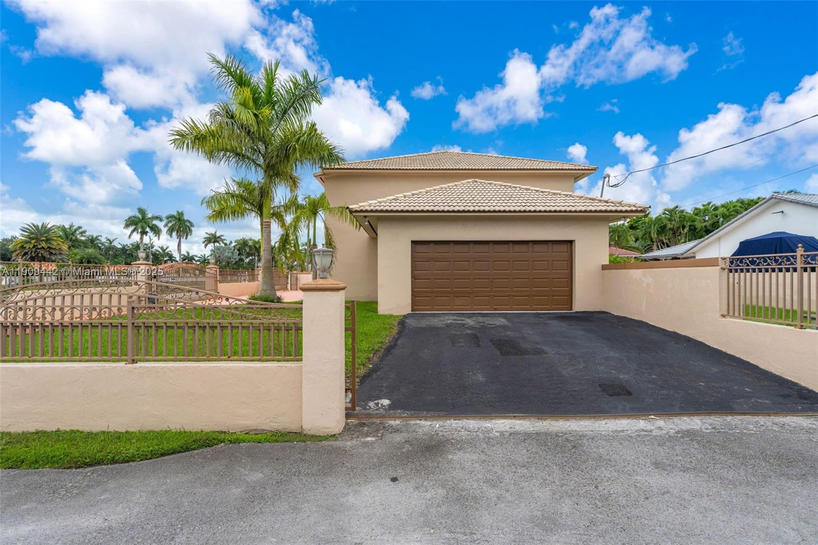 3200 Southwest 132nd Avenue Miami, FL 33175 - Photo 5 of 55 a front view of a house with a garden and yard