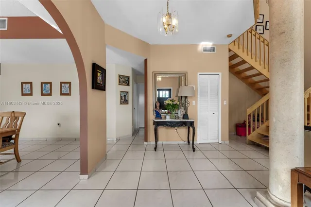 a living room with furniture or stairs and a couch