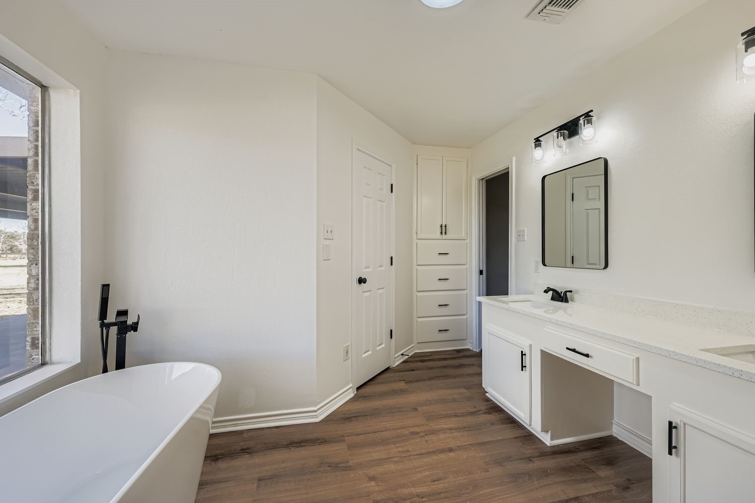 34411 Fulshear Farms Road Fulshear, TX 77441 - Photo 18 of 29 a spacious bathroom with a double vanity sink mirror and bathtub