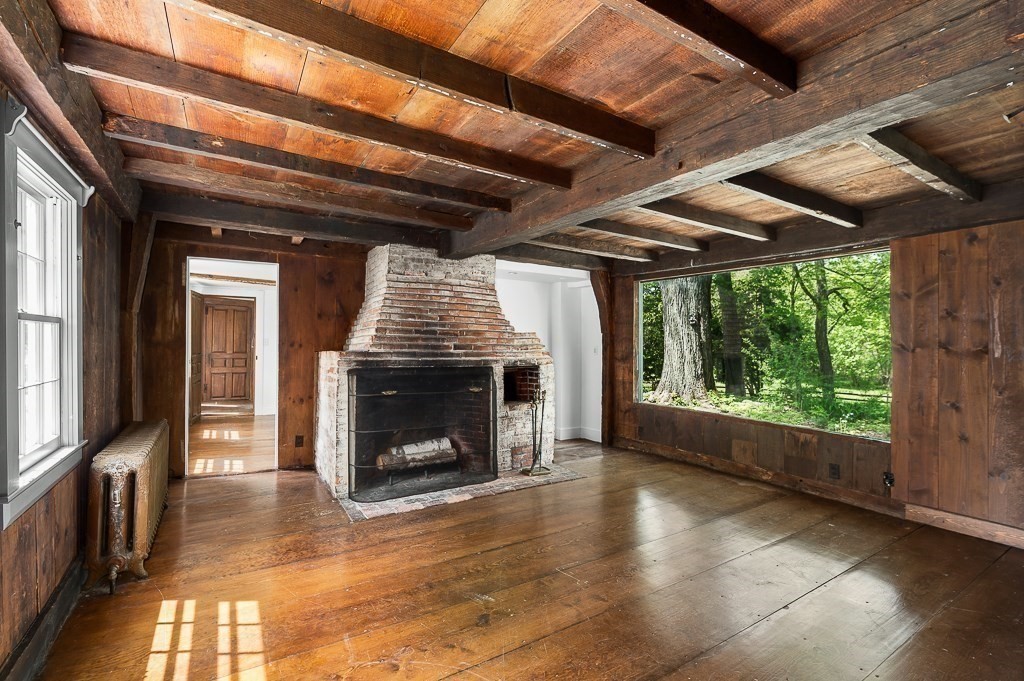 48 Topsfield Road Boxford, MA 01921 - Photo 17 of 34 a view of an empty room with wooden floor fire place and a window