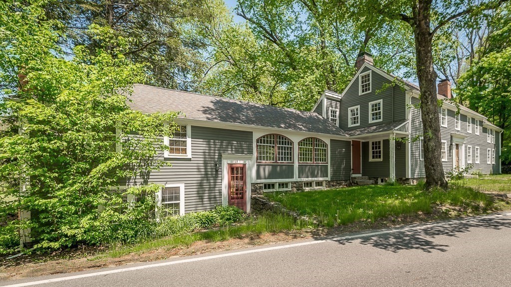 48 Topsfield Road Boxford, MA 01921 - Photo 3 of 34 a front view of a house with a garden and plants