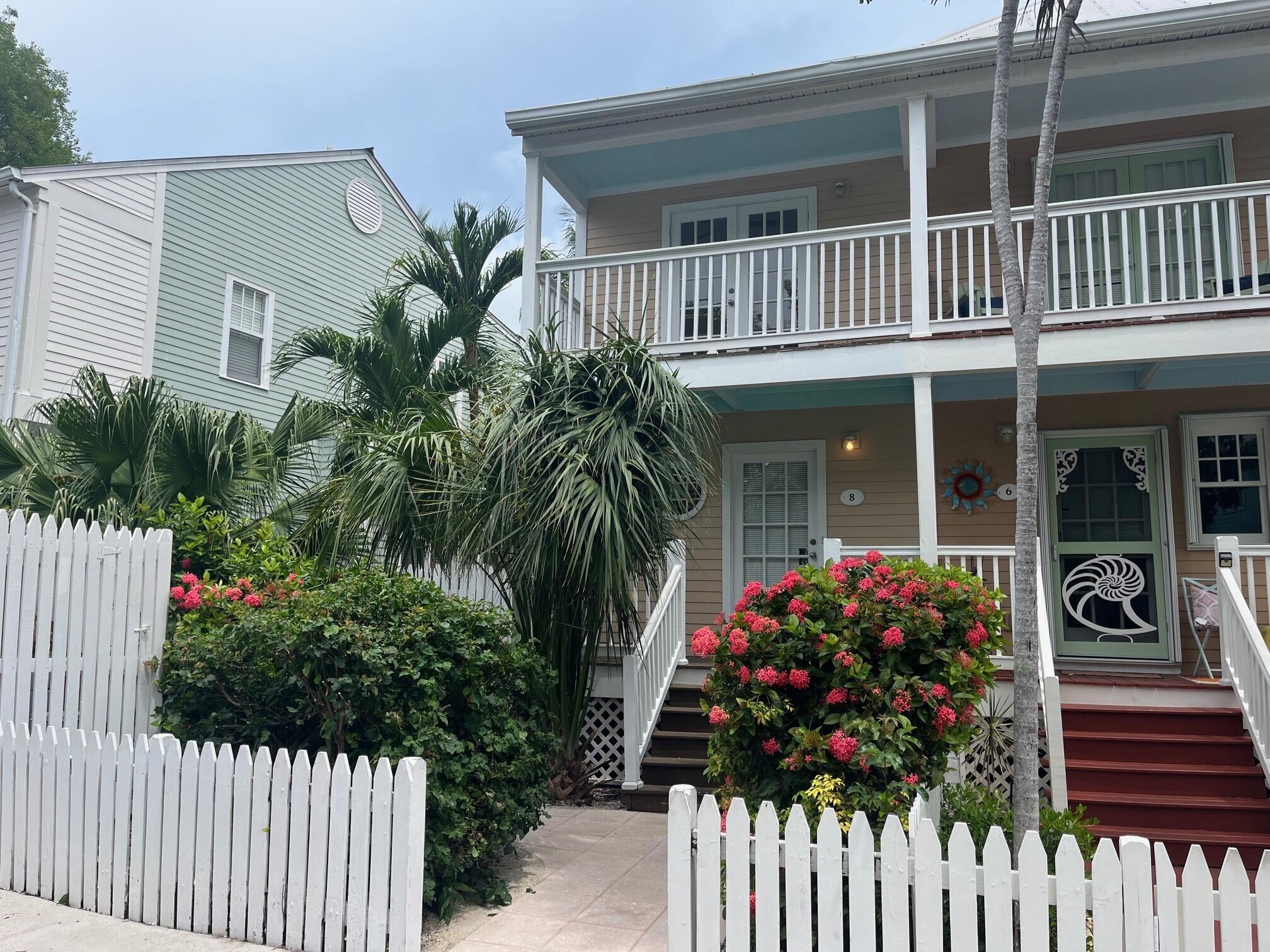 8 Kestral Way Key West, FL 33040 - Photo 1 of 4 a front view of a house with a porch