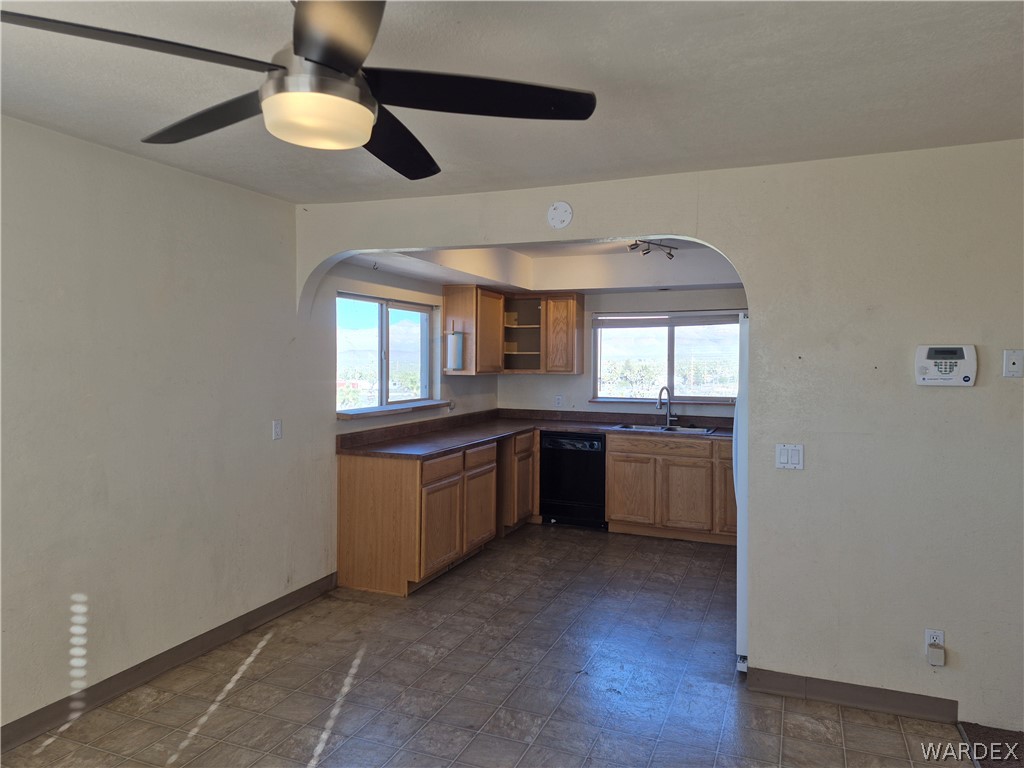 26432 Tamarisk Street, Unit STREET Meadview, AZ 86444 - Photo 16 of 60 Kitchen with open shelves, arched walkways, and healthy amount of natural light