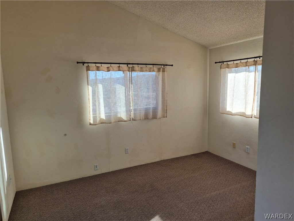 26432 Tamarisk Street, Unit STREET Meadview, AZ 86444 - Photo 29 of 60 View of carpeted spare room