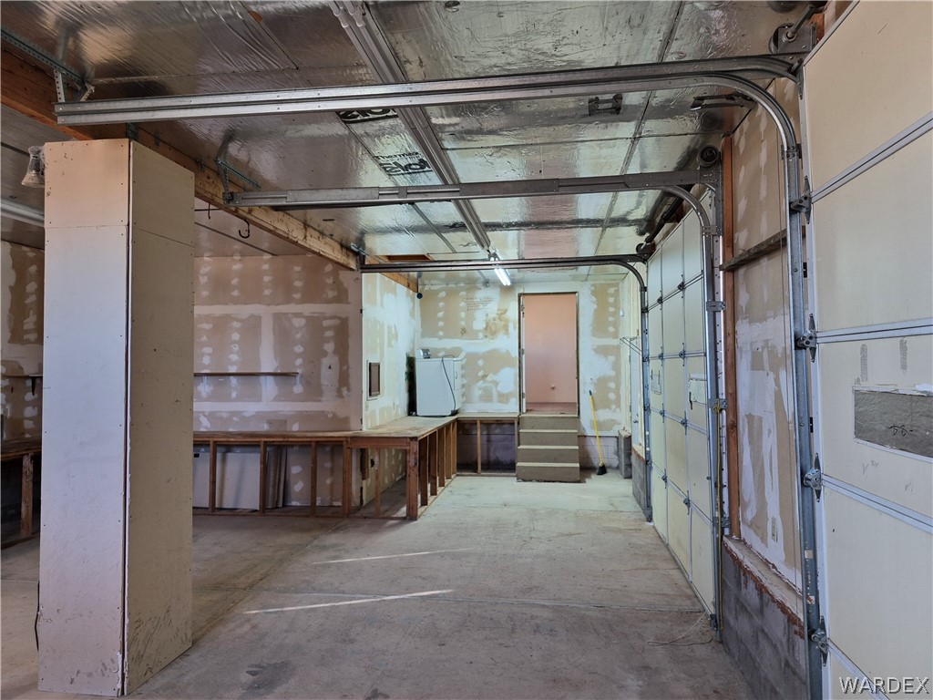 26432 Tamarisk Street, Unit STREET Meadview, AZ 86444 - Photo 55 of 60 20x40 Garage with built in shelving