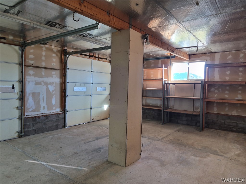 26432 Tamarisk Street, Unit STREET Meadview, AZ 86444 - Photo 56 of 60 20x40 Garage with built in shelving