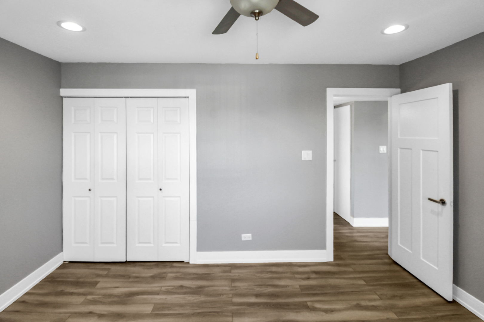 16622 Theresa Lane, Unit 304 Tinley Park, IL 60477 - Photo 14 of 16 a view of an empty room with wooden floor