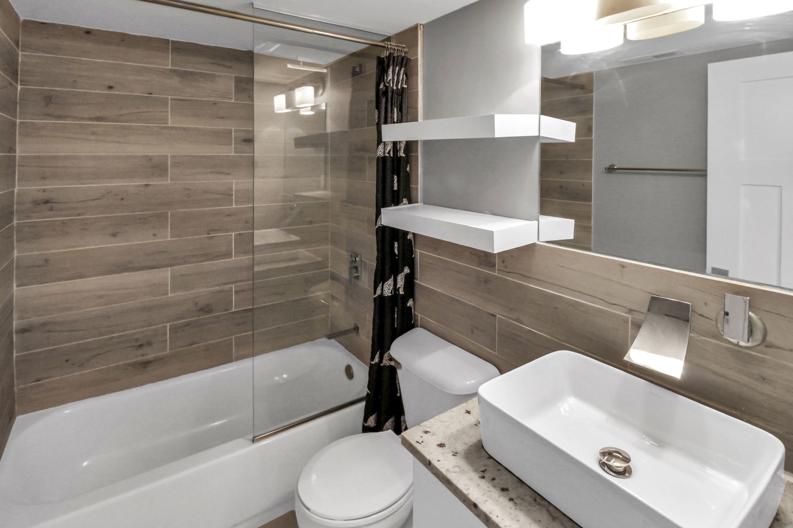 16622 Theresa Lane, Unit 304 Tinley Park, IL 60477 - Photo 16 of 16 a bathroom with a sink a toilet and shower