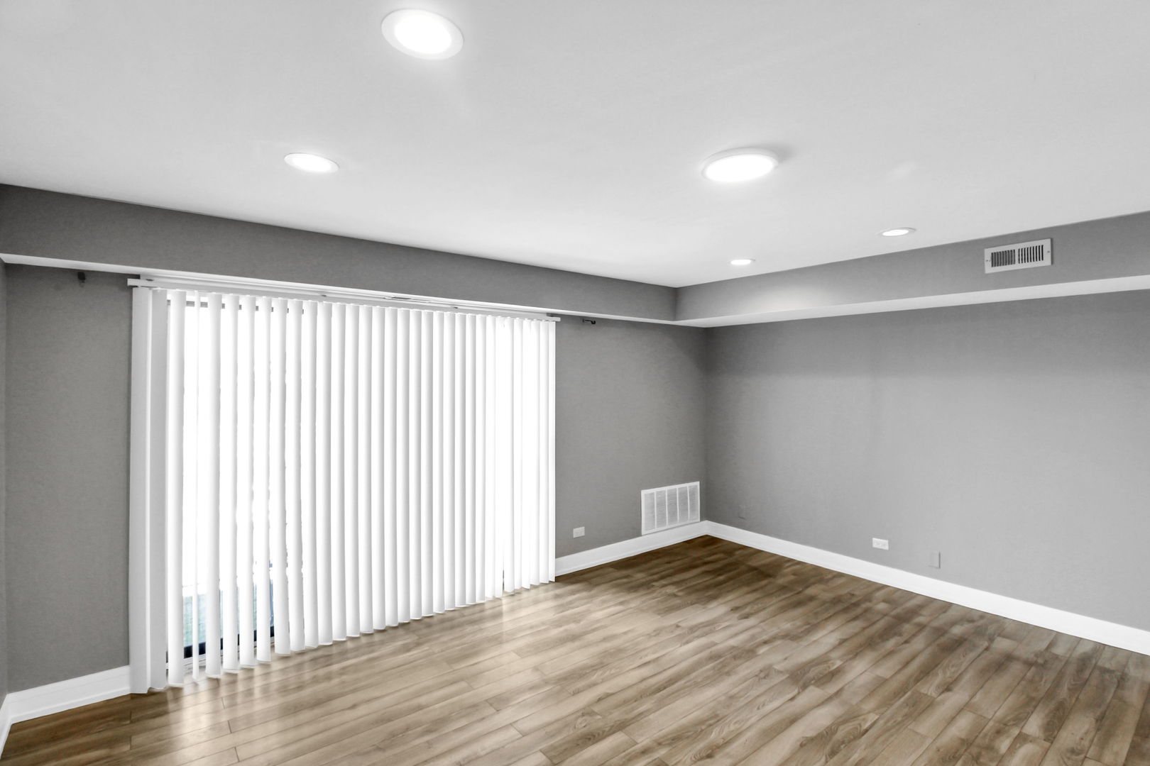 16622 Theresa Lane, Unit 304 Tinley Park, IL 60477 - Photo 3 of 16 wooden floor in an empty room with a window