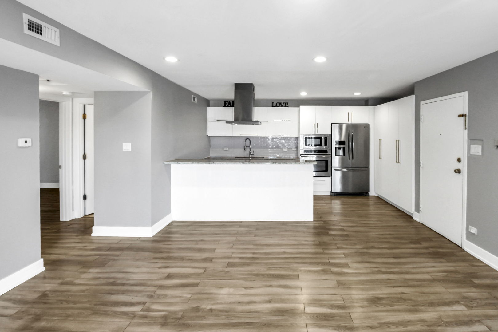 16622 Theresa Lane, Unit 304 Tinley Park, IL 60477 - Photo 7 of 16 a view of kitchen with wooden floor