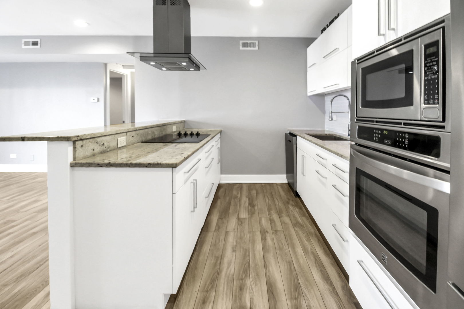 16622 Theresa Lane, Unit 304 Tinley Park, IL 60477 - Photo 9 of 16 a kitchen with granite countertop a sink and steel appliances