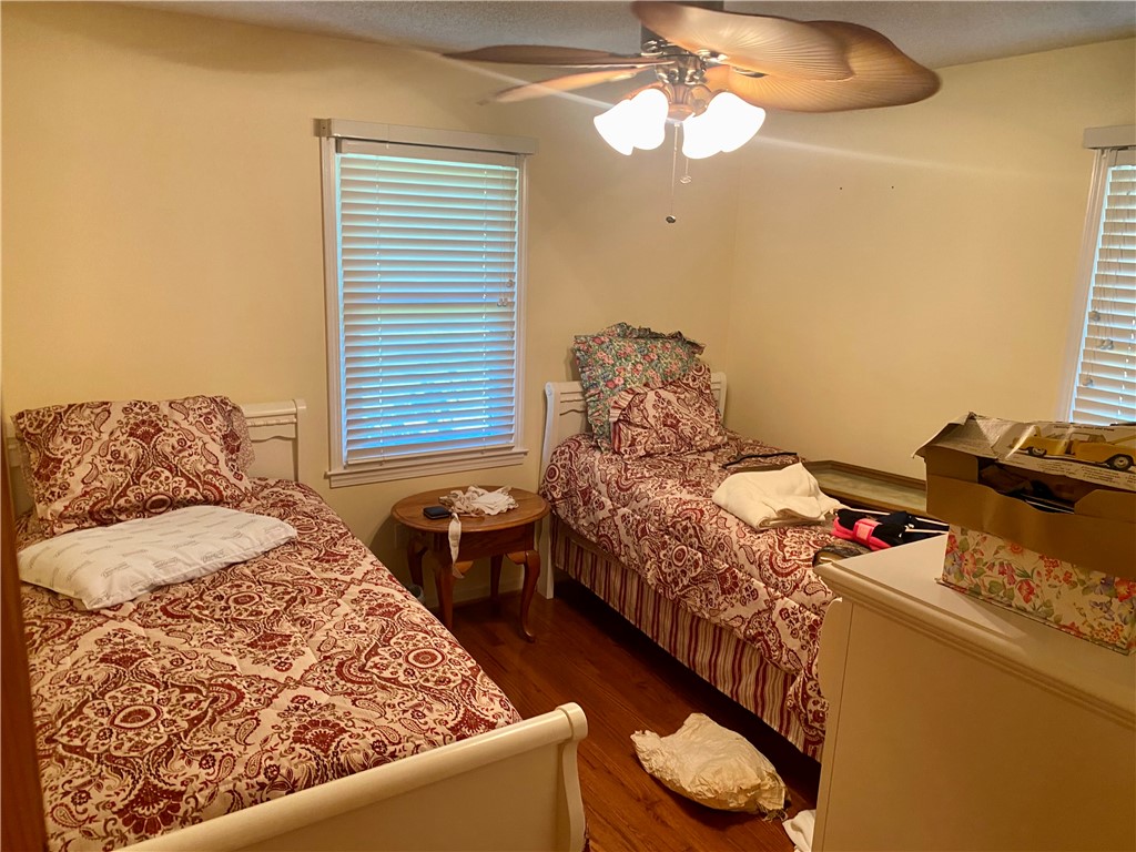 327 Five Forks Road Anderson, SC 29621 - Photo 25 of 31 Rich hardwood floors complement the neutral walls and dual windows in this cozy bedroom.