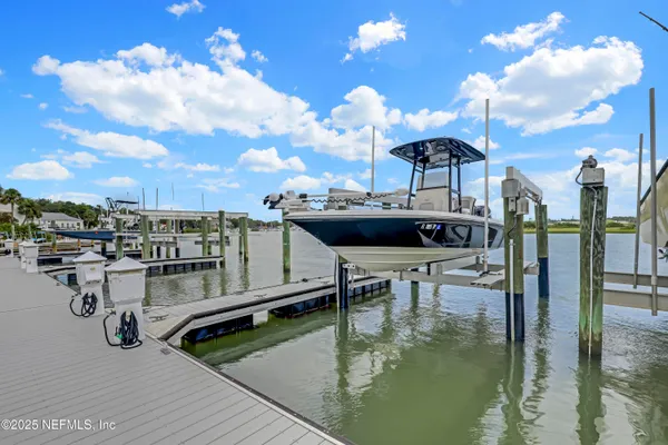 a view of a swimming pool with a table and chairs