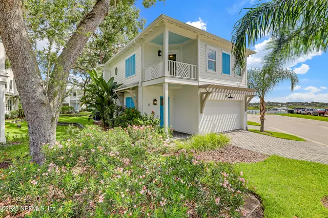 a kitchen with a stove a refrigerator a sink dishwasher with a dining table and chairs
