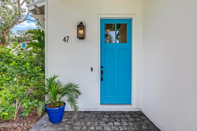 a kitchen with stainless steel appliances a stove microwave and sink