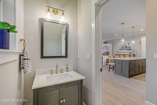 a view of a house with a big yard and large trees