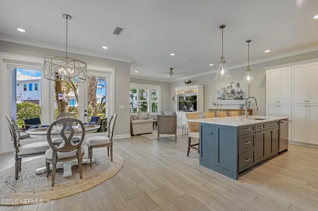 a large kitchen with a table and chairs
