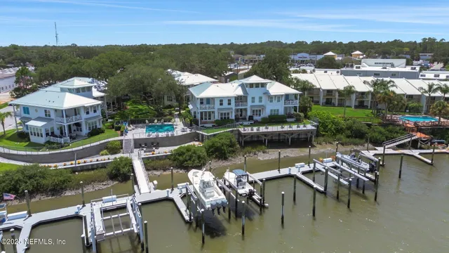 a bathroom with a tub sink mirror and shower