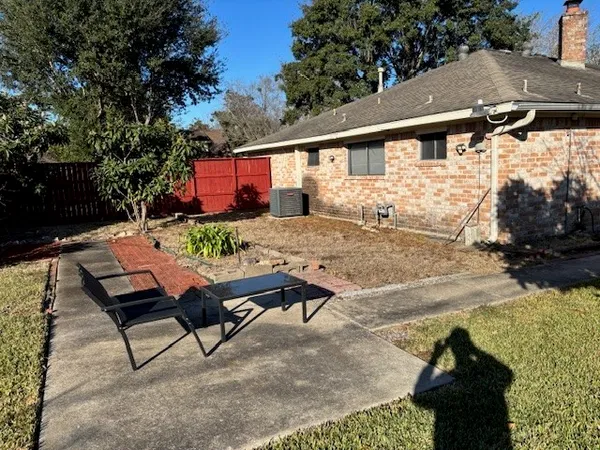 a view of backyard with outdoor seating
