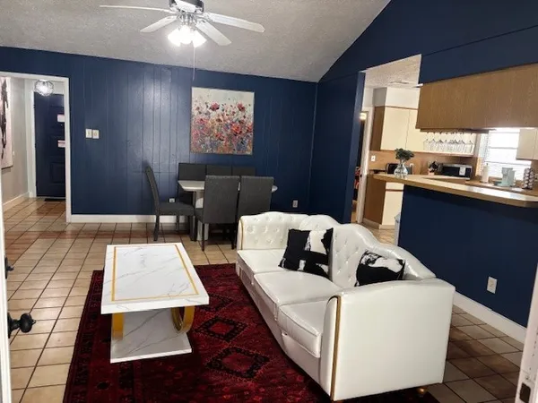 a living room with furniture and window