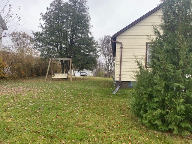 412 West 2nd Street Lostant, IL 61334 - Photo 16 of 22 a backyard of a house with table and chairs