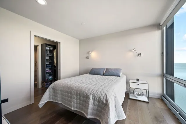 a bedroom with a bed and a tv on table