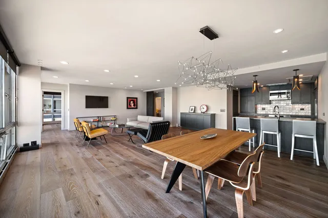 a outdoor kitchen with a table and chairs