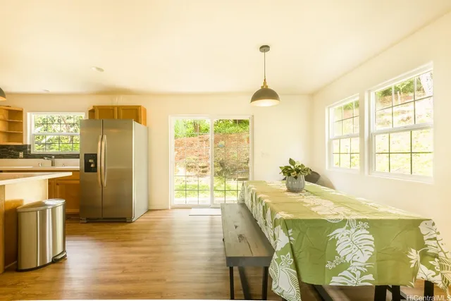 a kitchen with stainless steel appliances granite countertop a sink and cabinets