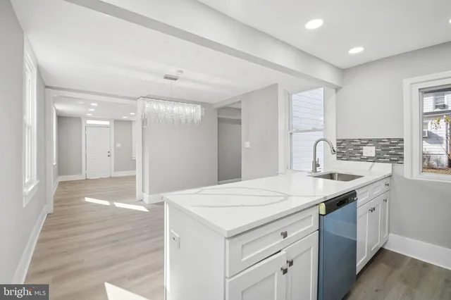 a kitchen with a sink and a refrigerator