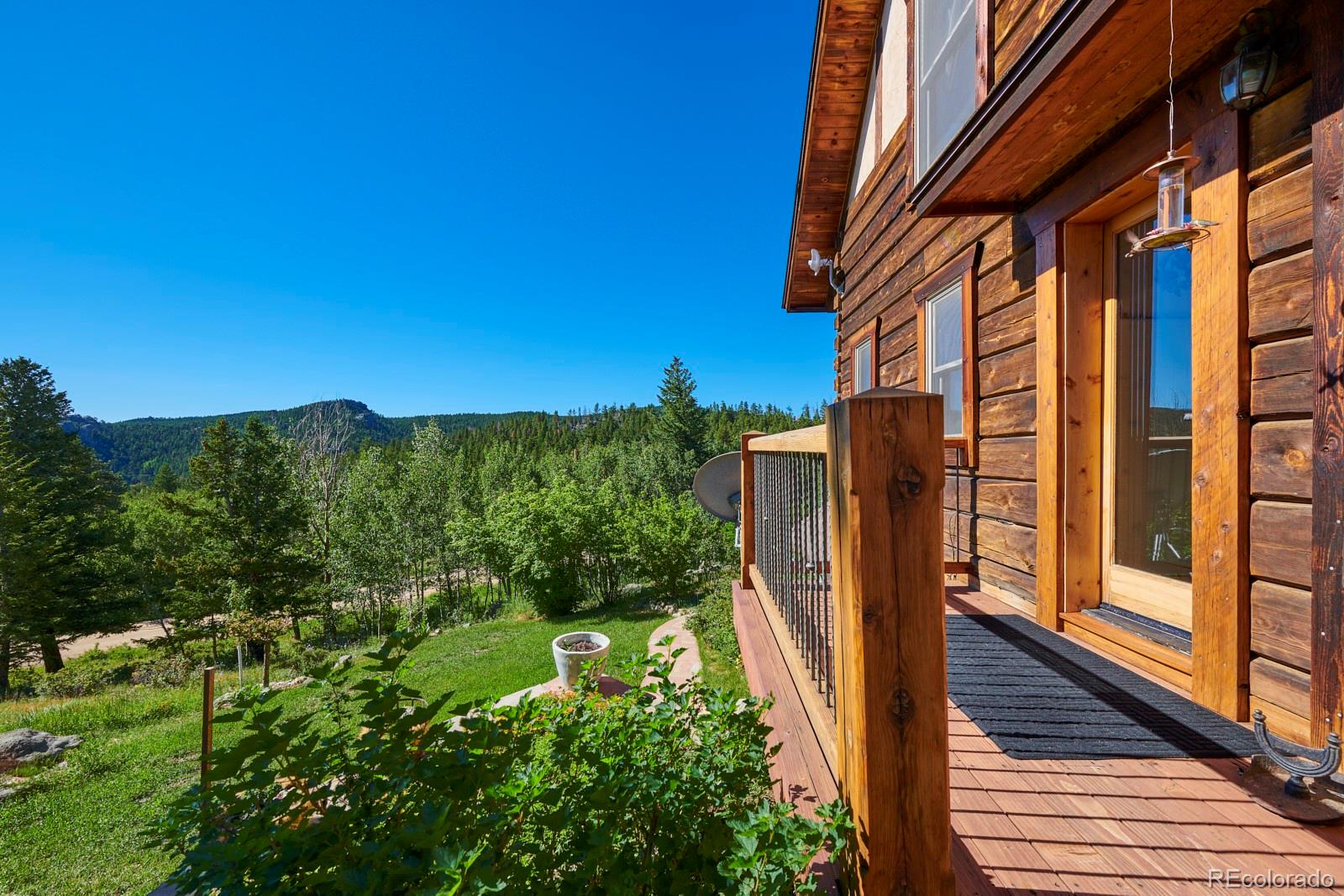 2847 Ridge Road Nederland, CO 80466 - Photo 13 of 40 a view of a balcony with wooden floor and fence