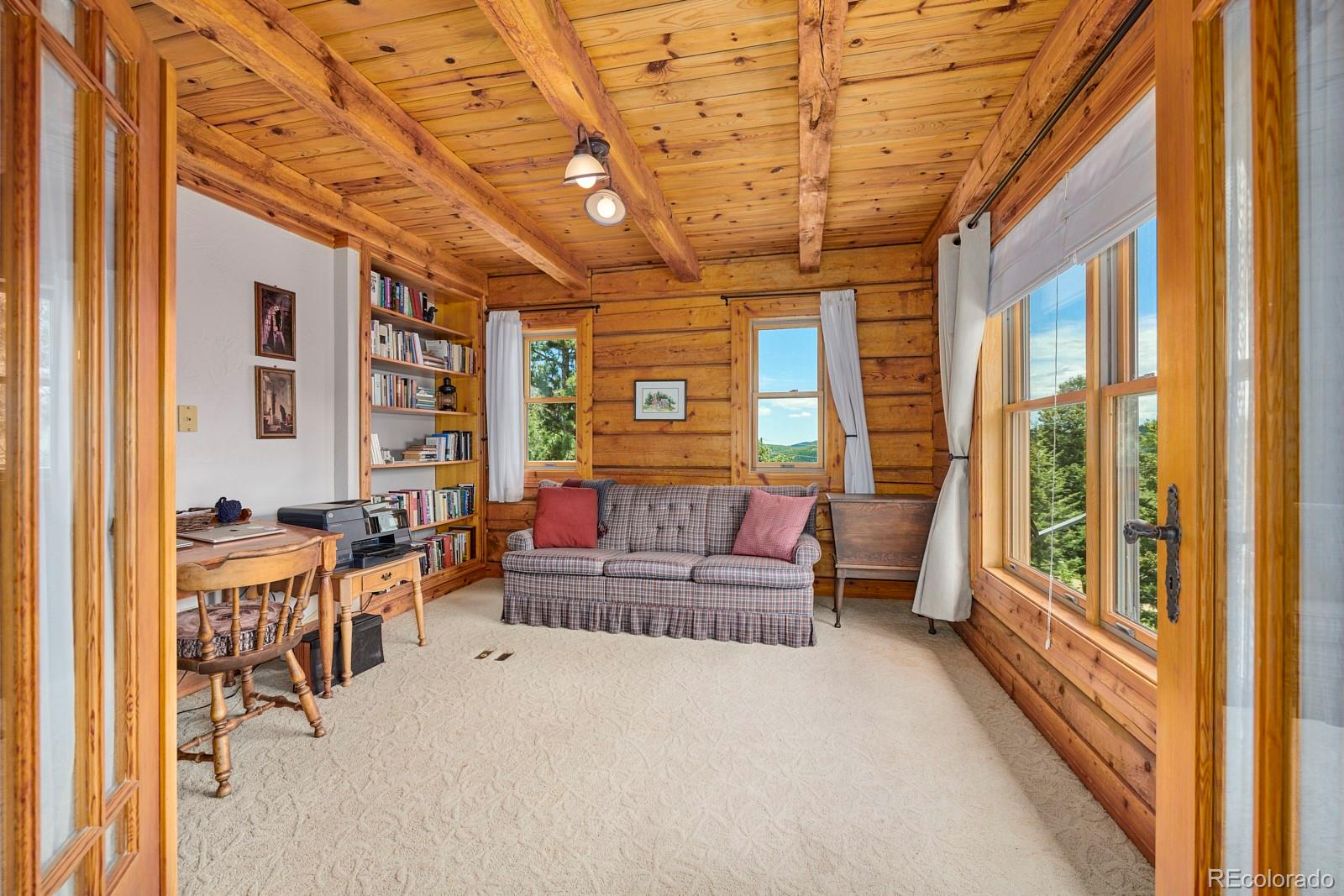 2847 Ridge Road Nederland, CO 80466 - Photo 14 of 40 a living room with furniture and a large window