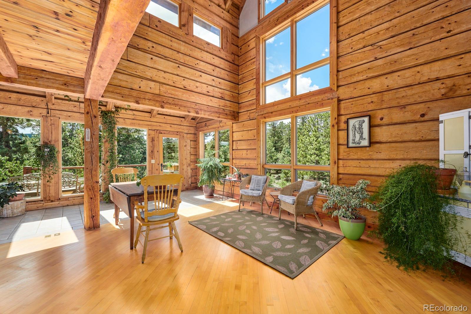2847 Ridge Road Nederland, CO 80466 - Photo 16 of 40 a living room with large windows