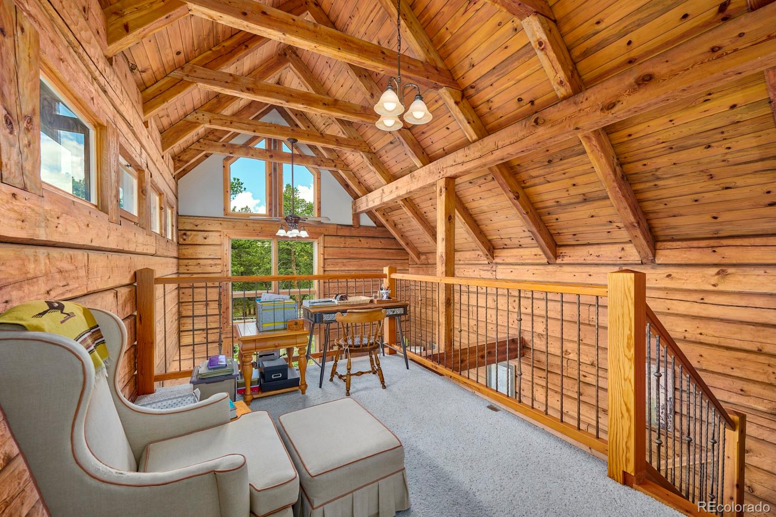 2847 Ridge Road Nederland, CO 80466 - Photo 18 of 40 a view of a patio with couches fire pit and furniture