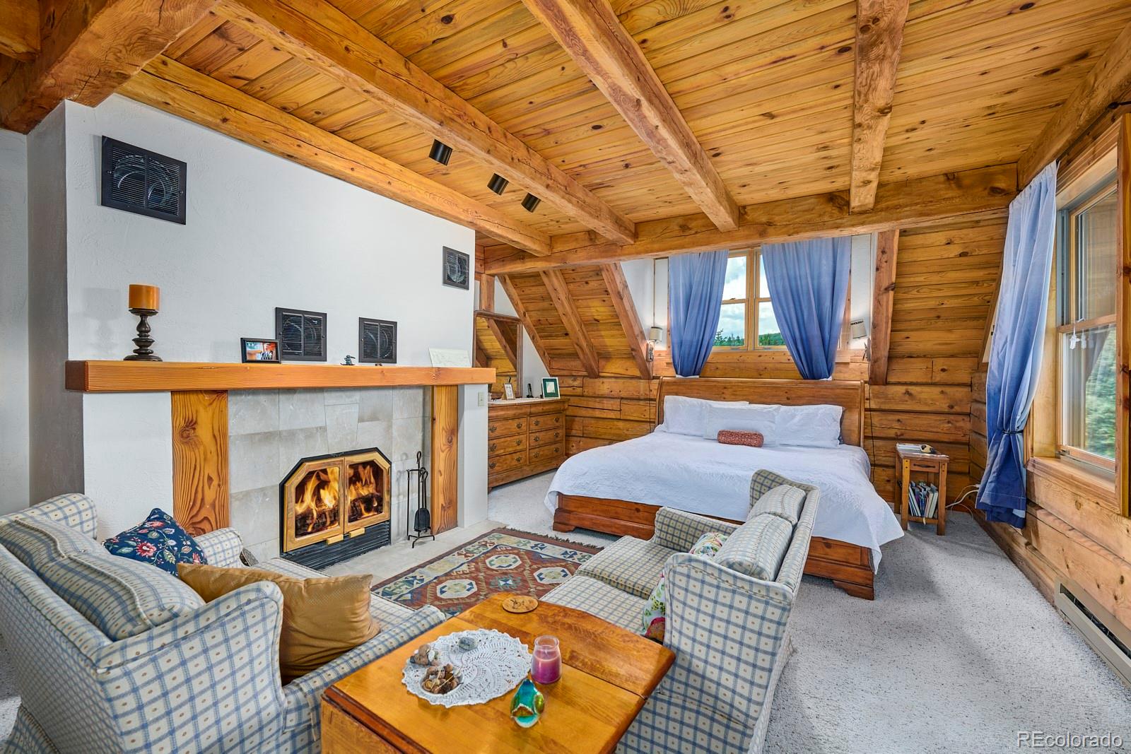 2847 Ridge Road Nederland, CO 80466 - Photo 19 of 40 a living room with furniture and a flat screen tv