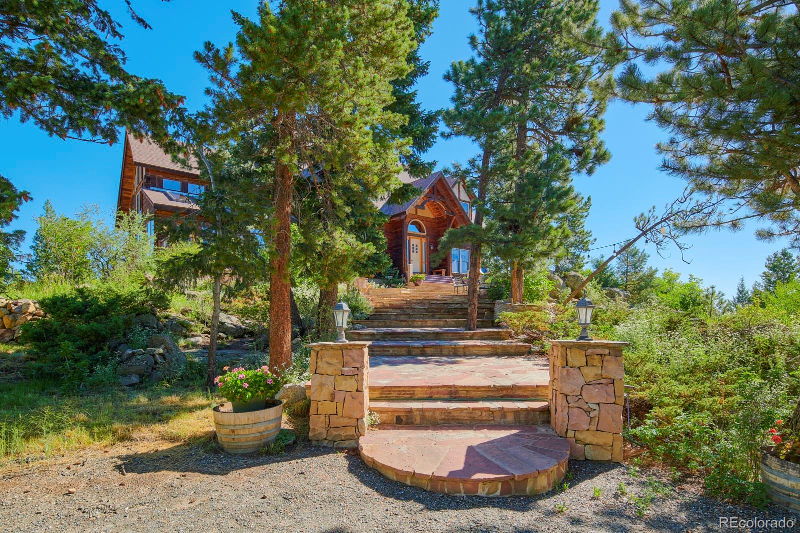 2847 Ridge Road Nederland, CO 80466 - Photo 2 of 40 a view of a house with a yard