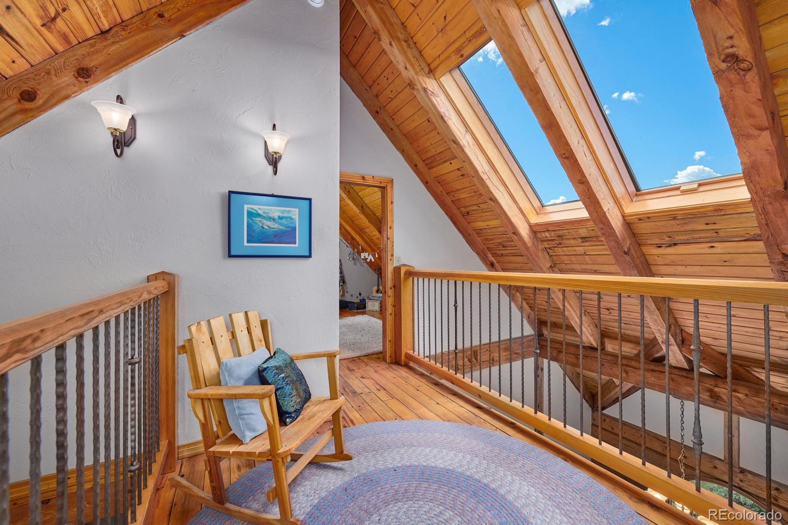 2847 Ridge Road Nederland, CO 80466 - Photo 25 of 40 a view of staircase with furniture and a rug