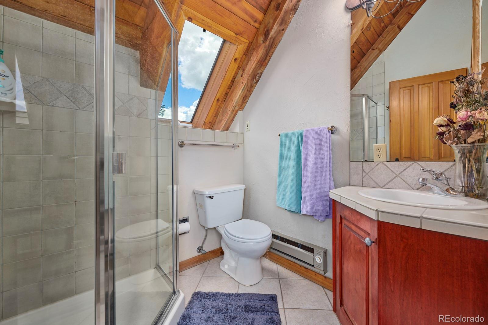 2847 Ridge Road Nederland, CO 80466 - Photo 27 of 40 a bathroom with a sink and toilet